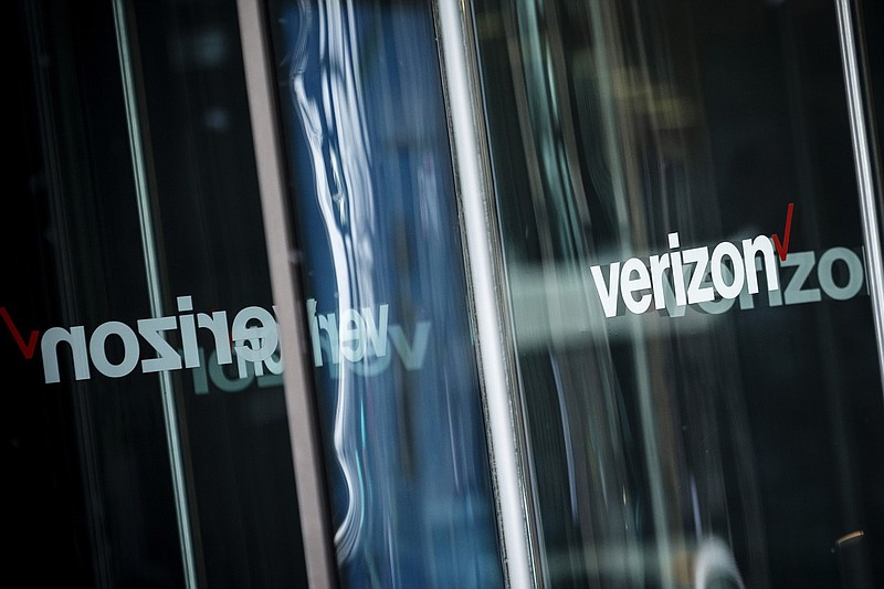 Signage is displayed on the doors of a Verizon Communications Inc. store in Chicago on Jan. 24, 2019. MUST CREDIT: Bloomberg photo by Christopher Dilts.