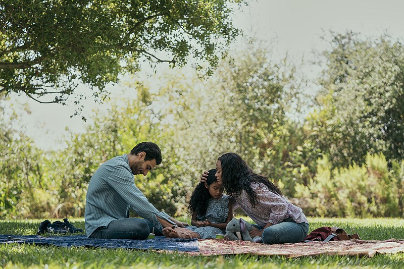 Eugenio Mastrandrea (left), Isla Colbert and Zoe Saldana perform in a scene from “From Scratch,” a new series on Netflix. (Netflix via AP/Jessica Brooks)