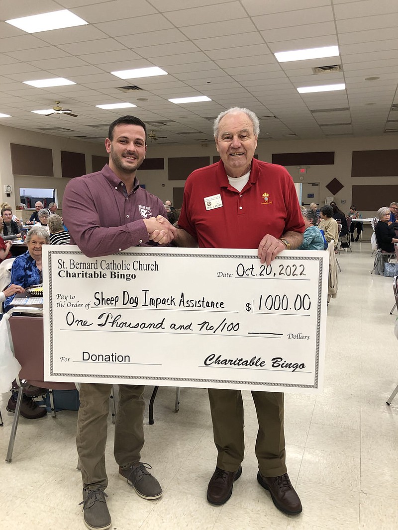 On Oct. 20, St. Bernard’s Charitable Bingo presented a check in the amount of $1,000 to Tim Hocut (left) of Sheep Dog Impact Assistance. Presenting the check is Paul Meyer representing St. Bernard Catholic Church in Bella Vista. Bingo is played at 6:30 p.m. on the third Thursday of the month in the parish hall. A snack bar is available during bingo as well. All are welcome.

(Courtesy Photo)