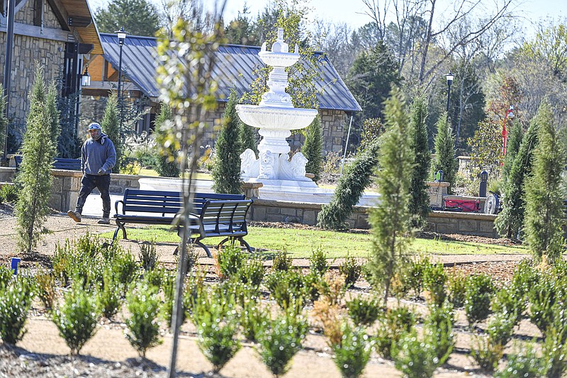 A worker with Rick Mooney Construction walks past a fountain Oct. 19 at the Arkansas Colleges of Health Education's Celebration Garden and Wellness Park in Barling. The college will host a grand opening and ribbon cutting for the park on Nov. 5. Visit nwaonline.com/221030Daily/ for today's photo gallery.
(NWA Democrat-Gazette/Hank Layton)