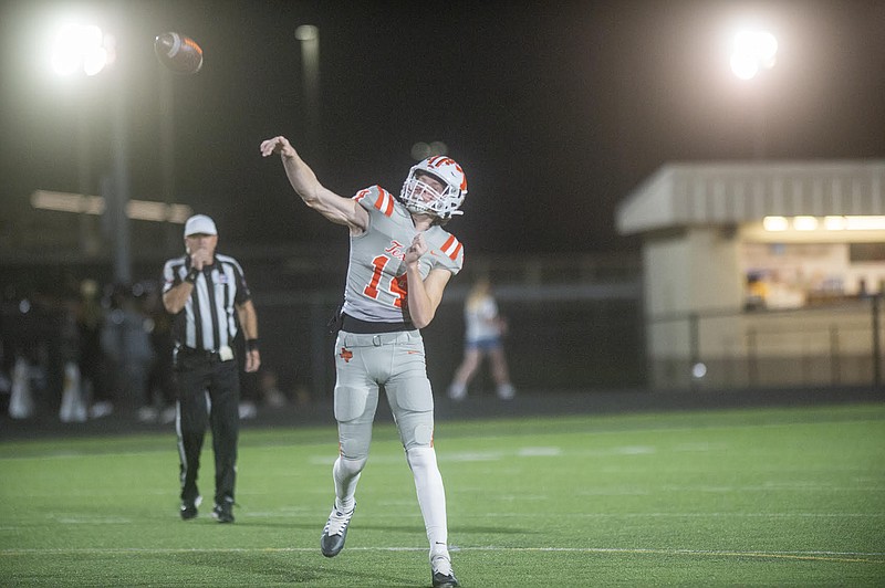 Texas High’s quarterback David Potter (14) throws for a touchdown during the first half of Friday’s high school football game against Nacogdoches. (Josh Edwards/The Daily Sentinel)