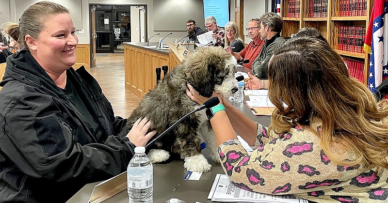 TIMES photograph by Annette Beard
School Resource Officer Mindy Fowler introduced her new therapy pup to the Pea Ridge City Council Tuesday, Oct. 18, 2022.