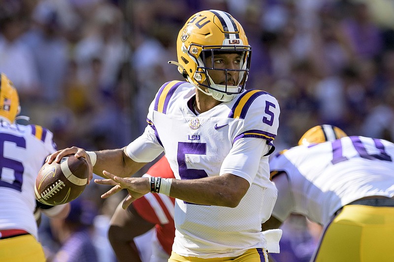 LSU quarterback Jayden Daniels (5) looks to throw during the first half against Ole Miss Saturday in Baton Rouge, La. - Photo by Matthew Hinton of The Associated Press