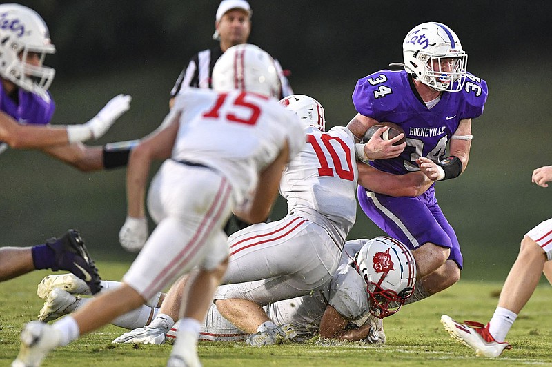 Dax Goff (34) of Booneville carries the ball as Wyatt Simmons (10) and Peyton Cole (30) of Harding Academy pursue, Friday, Sept. 16, 2022, during the first quarter of the Wildcats’ 44-14 win at Bearcat Stadium in Booneville. Visit nwaonline.com/220917Daily/ for today's photo gallery.
(NWA Democrat-Gazette/Hank Layton) Dax Goff (34) of Booneville carries the ball as Wyatt Simmons (10) and Peyton Cole (30) of Harding Academy pursue, Friday, Sept. 16, 2022, during the first quarter of the Wildcats’ 44-14 win at Bearcat Stadium in Booneville. Visit nwaonline.com/220917Daily/ for today's photo gallery.
(NWA Democrat-Gazette/Hank Layton)