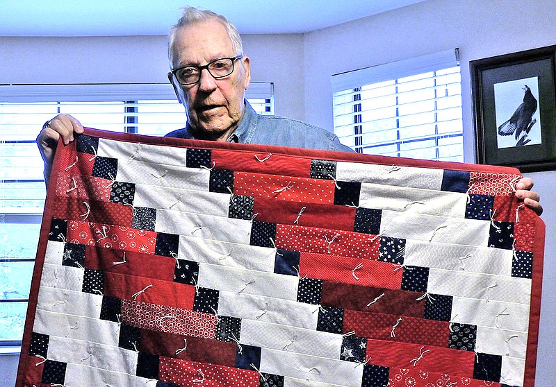 For almost two decades, Diana Beatty has made hundreds of quilts to donate to veterans. - Photo by Lance Brownfield of The Sentinel-Record