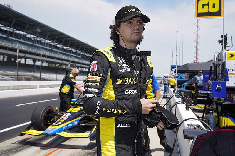 FILE - Colton Herta prepares to drive during practice for the IndyCar auto race at Indianapolis Motor Speedway in Indianapolis, Friday, May 20, 2022. Colton Herta has signed a four-year contract extension with Andretti Autosport that ties him to the IndyCar team through 2027. The agreement announced Tuesday, Oct. 25, 2022, includes a concurrent contract extension with sponsor Gainbridge, which could signify the end of Herta’s Formula One ambitions and acknowledgement that Michael Andretti is not getting an F1 team. (AP Photo/Michael Conroy, File)