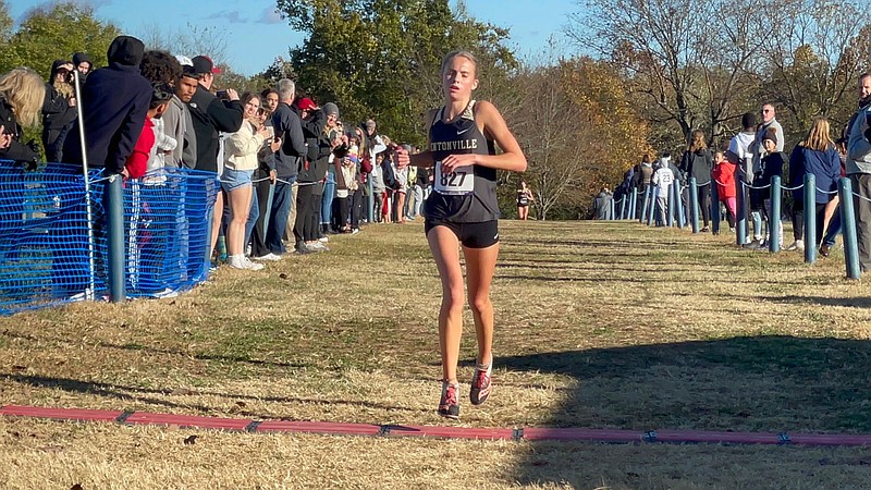 Bentonville's Haley Loewe wins the 6A-West Conference girls individual championship during Tuesday's meet at Rogers. Loewe ran the 5,000-meter course in 18 minutes, 21.72 seconds. (Photo by Henry Apple)