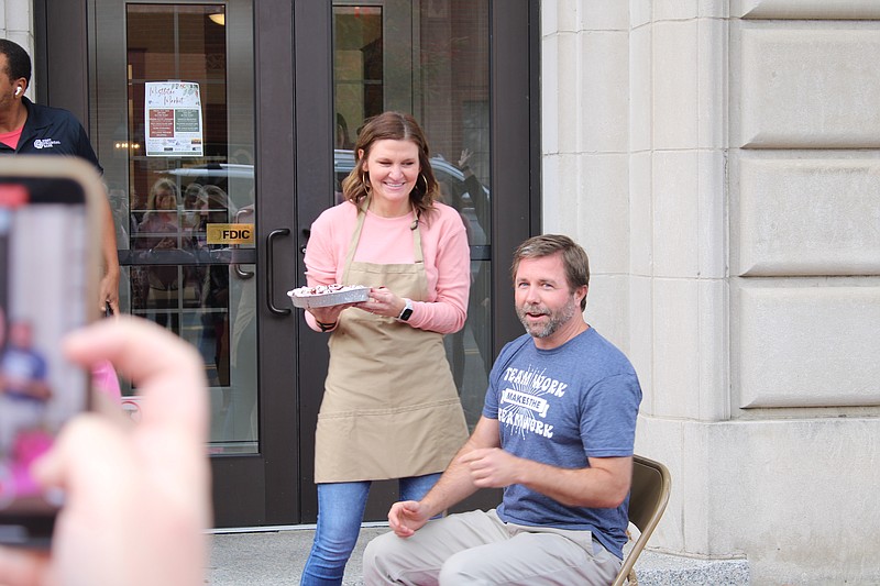 Craig Mobley, right, First Financial Bank executive vice president, says his final words on Friday morning before Jade Beer, mortgage loan officer at the bank, pies him in the face as part of the bank's fundraiser for the United Way of Union County. (Caitlan Butler/News-Times)