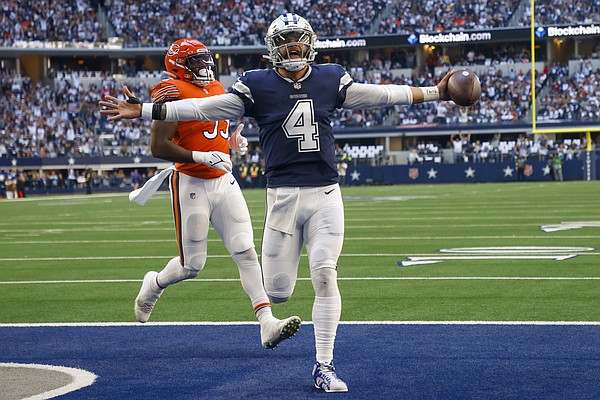 A Dallas Cowboys fan wears a costume during the first half of an NFL  football game against the Chicago Bears Sunday, Oct. 30, 2022, in  Arlington, Texas. (AP Photo/Ron Jenkins Stock Photo 