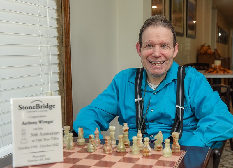 Julie Smith/News Tribune photo:
Anthony Winegar is shown at his chess table at Oak Trees Villa, where Winegar has been a resident for 30 years. Chess is his game and loves to play every chance he gets.