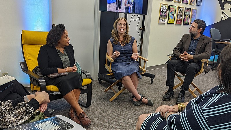 Jen Gerber, center, and Sonny Kay, right, tell Maria Rosario Jackson about Low Key Arts and the Inception to Projection program from the new digital arts studio. – Photo by Courtney Edwards of The Sentinel-Record
