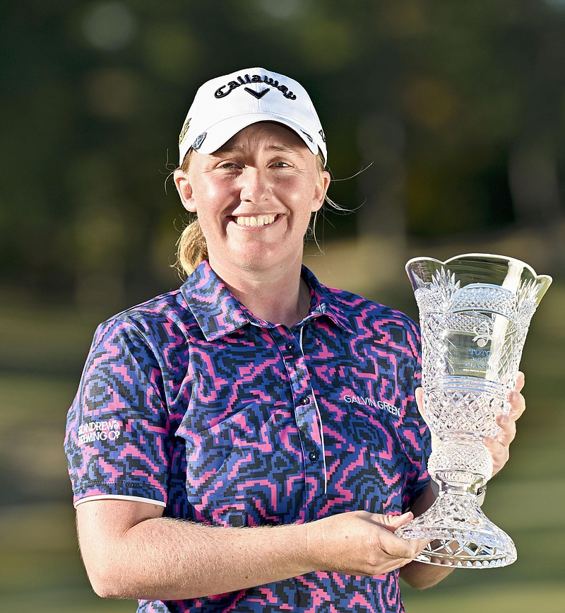 Gemma Dryburgh of Scotland holds the trophy after winning the LPGA Tour's Toto Japan Classic at the Seta Golf Club in Shiga, Japan, Sunday, Nov. 6, 2022. (Kyodo News via AP)