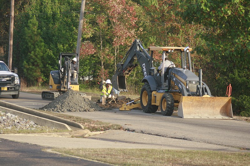 Summit Utilities workers work on 12th Street in El Dorado late Monday afternoon. 12th Street was closed "until further notice" from College Ave to Newton Monday afternoon due to a "gas leak," according to a post made by the El Dorado Police Department. (Matt Hutcheson/News-Times)