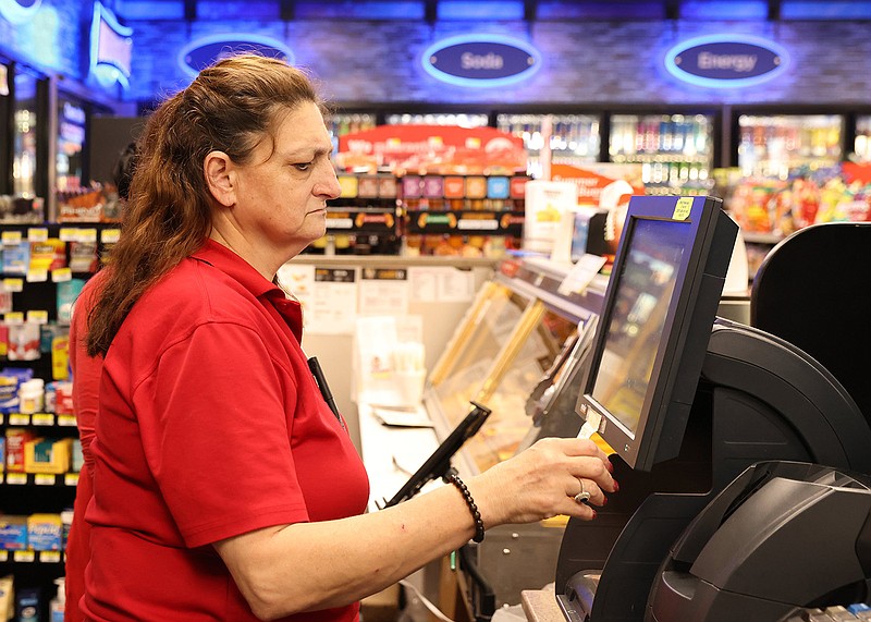 Lisa Folsom prints out a Powerball lottery ticket for a customer at the Circle K convenience store on John F. Kennedy Blvd. in North Little Rock on Monday, Nov. 7, 2022. (Arkansas Democrat-Gazette/Colin Murphey)
