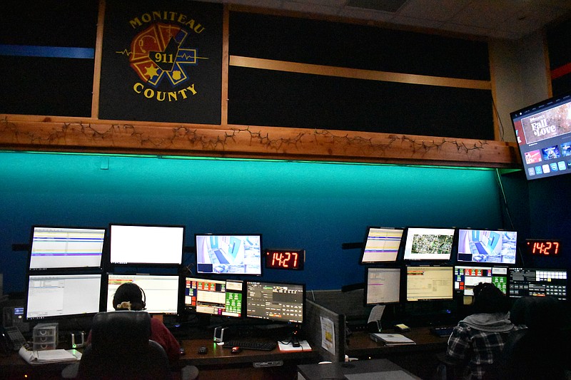 Democrat photo/Garrett Fuller — Two telecommunicators are seen Thursday in the Moniteau County Emergency Dispatch center.