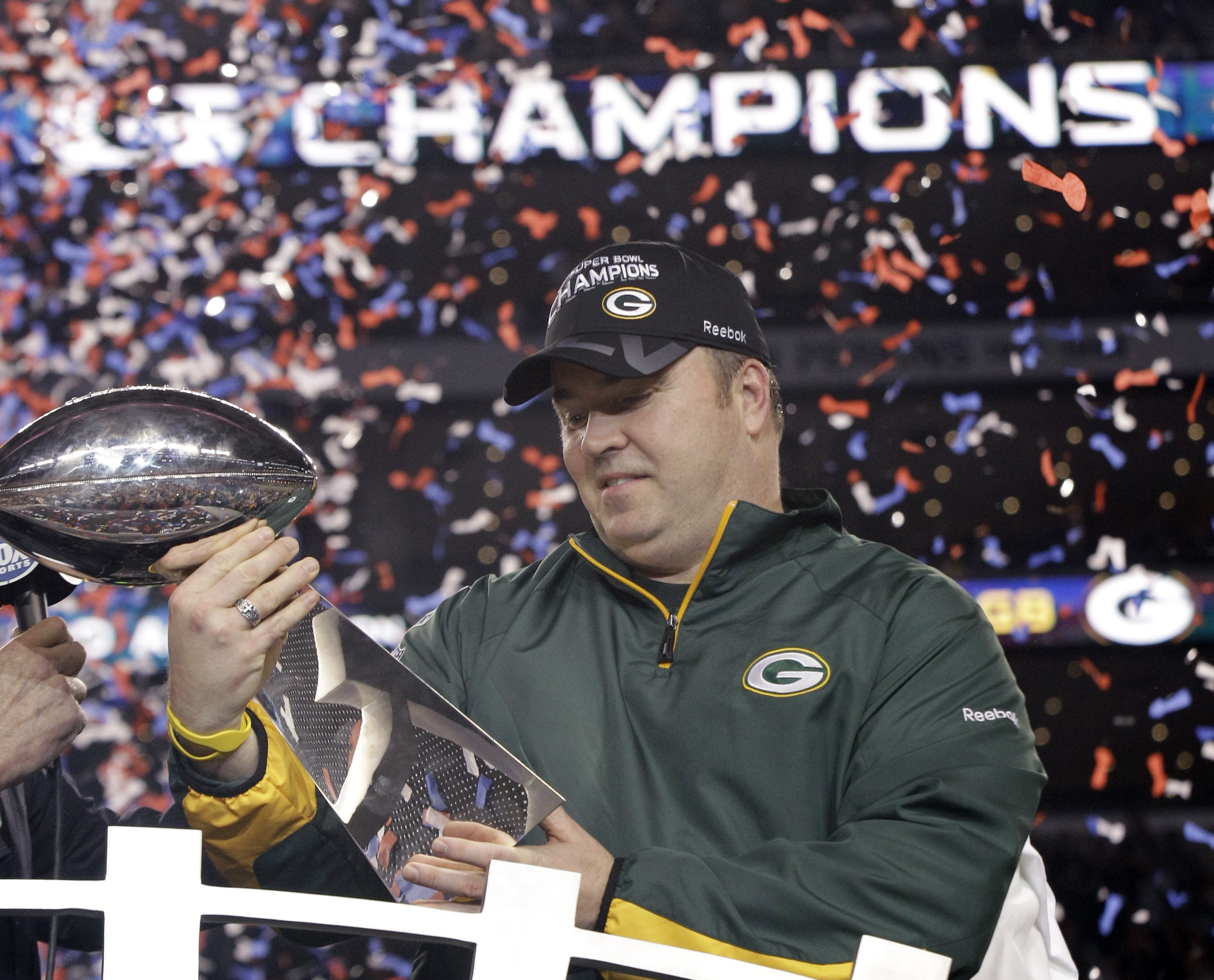 FILE - The Green Bay Packers football team carry coach Vince