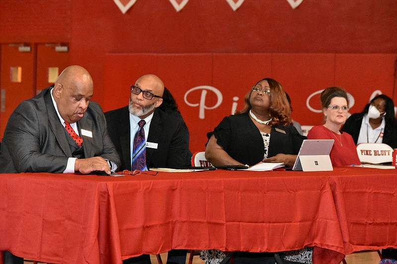 From left, assistant superintendents Kelvin Gragg and Phillip Carlock, Superintendent Barbara Warren and director of curriculum and instruction Dee Davis listen to comments during the Pine Bluff School District annual report to the public on Oct. 27. (Pine Bluff Commercial/I.C. Murrell)