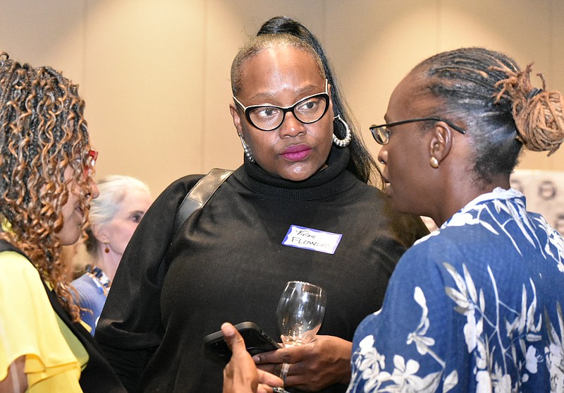 District 65 State Rep. Vivian Flowers, D-Pine Bluff, speaks with Goldi Gaines (right), a candidate for state land commissioner, and another person at the Arkansas Democratic watch party in Little Rock on Tuesday. (Pine Bluff Commercial/I.C. Murrell)