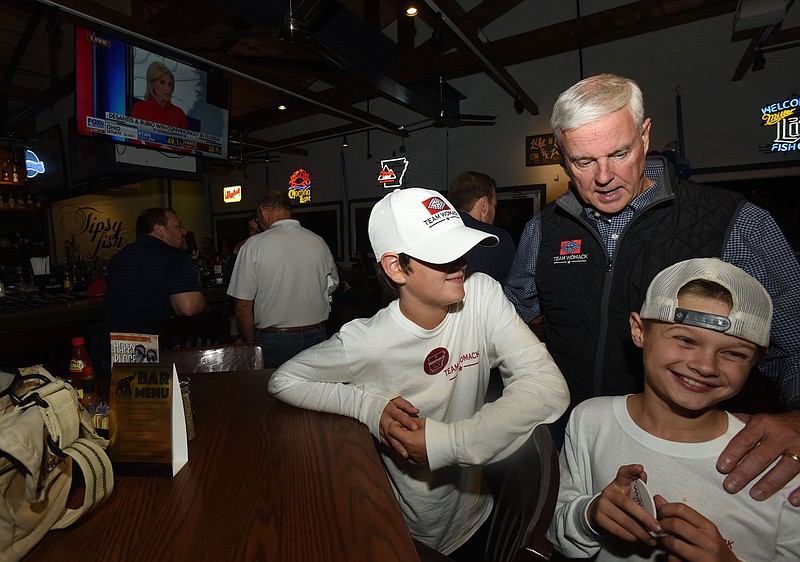 U.S. Rep. Steve Womack (R-Rogers) watches election returns on Tuesday Nov. 8 2022 with family and friends including nephew Carson Womack (left) and grandson Kaden Womack, 9. Go to nwaonline.com/221109Daily/ to see more photos.
(NWA Democat-Gazette/Flip Putthoff)
