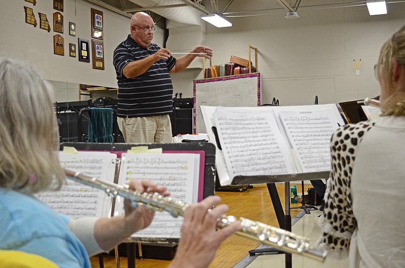 Eileen Wisniowicz/News Tribune photo: 
Paul Hinman directs the Community Band during rehearsal on Tuesday, Nov. 8, 2022 at Helias High School. Hinman is one of the founding members of the Community Band.
