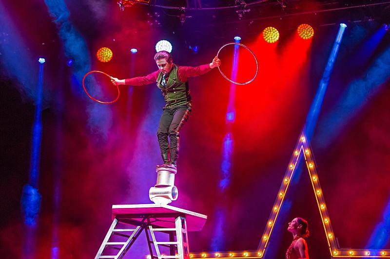 Oleksiy “Alex” Mruz balances on the Rola Bola in “A Magical Cirque Christmas,” onstage today at Little Rock's Robinson Center Performance Hall and Friday at El Dorado's First Financial Music Hall. (Special to the Democrat-Gazette/Lou Baldanza)