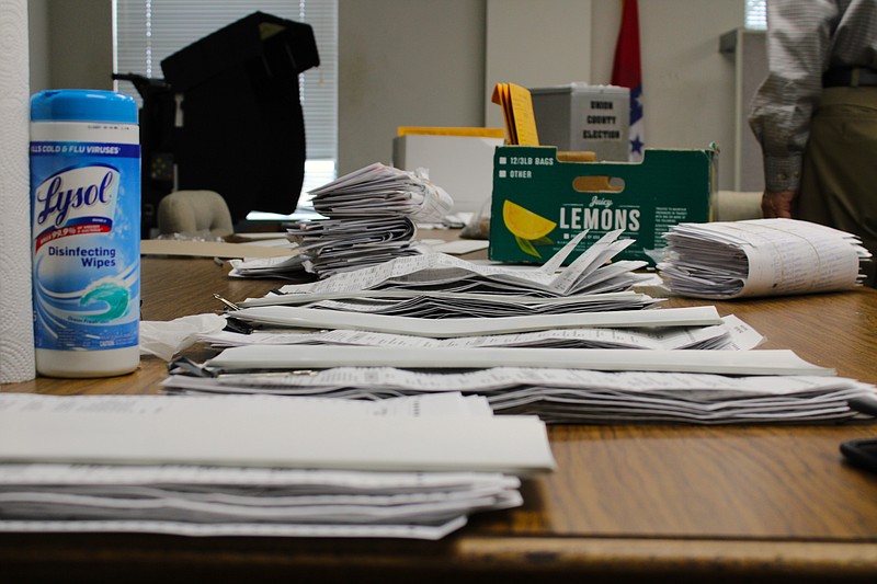 A stack of absentee ballots awaiting counting sits on a table at the Union County Courthouse on Tuesday, Nov. 8. (Caitlan Butler/News-Times)