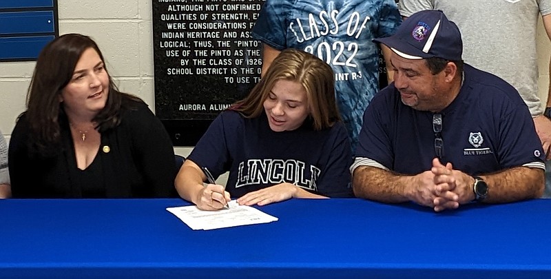 California's Ella Percival signs her letter of commitment to play college softball at Lincoln University. (Photo submitted by California High School)
