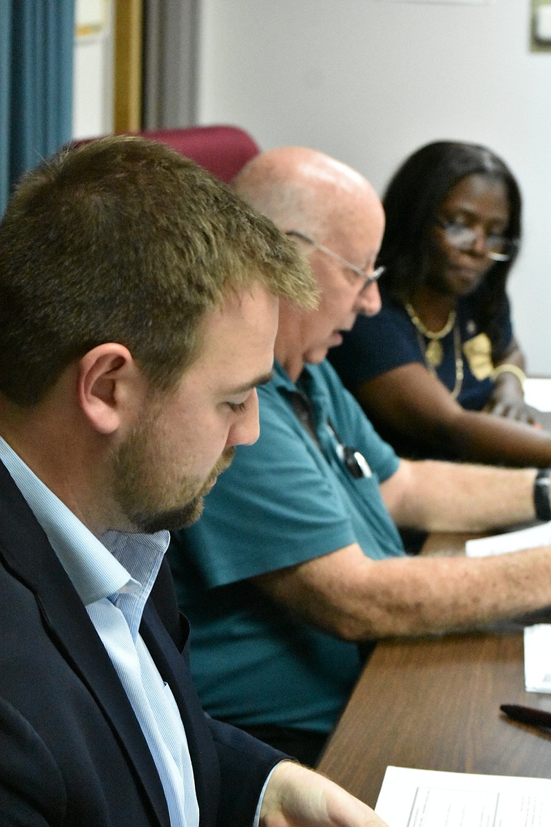 From left, Jefferson County election commissioners Samuel Beavers, Michael Adam and Sharon Hardin review provisional ballots during a special meeting Wednesday. (Pine Bluff Commercial/I.C. Murrell)