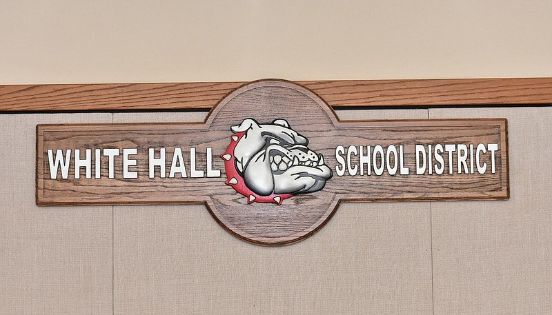 A White Hall School District wooden masthead hangs in the district boardroom. (Pine Bluff Commercial/I.C. Murrell)