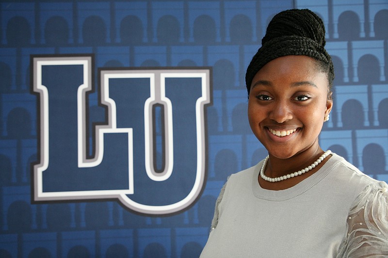 Anna Watson/News Tribune photo: Octavia Ailsworth stood before a Lincoln University emblem in at Scruggs University Center on Friday, Nov. 11, 2022. She serves as the student liaison to the Jefferson City Council.