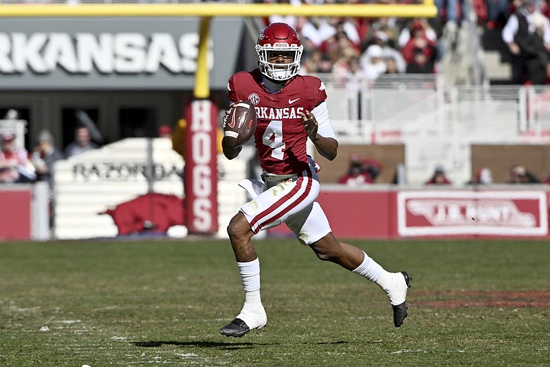 Arkansas quarterback Malik Hornsby (4) runs out of the pocket against LSU during the first half of an NCAA college football game Saturday, Nov. 12, 2022, in Fayetteville, Ark. (AP Photo/Michael Woods)