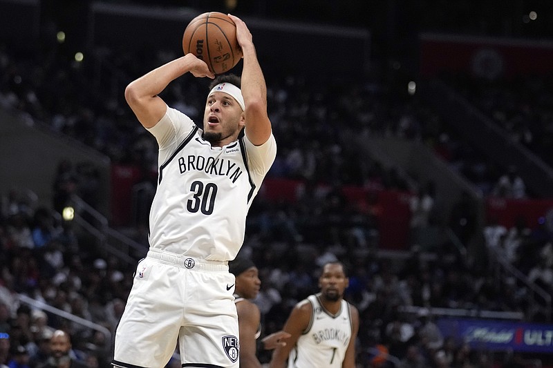 Brooklyn Nets guard Seth Curry (30) shoots against the Los Angeles Clippers during the second half of an NBA basketball game Saturday, Nov. 12, 2022, in Los Angeles. (AP Photo/Marcio Jose Sanchez)