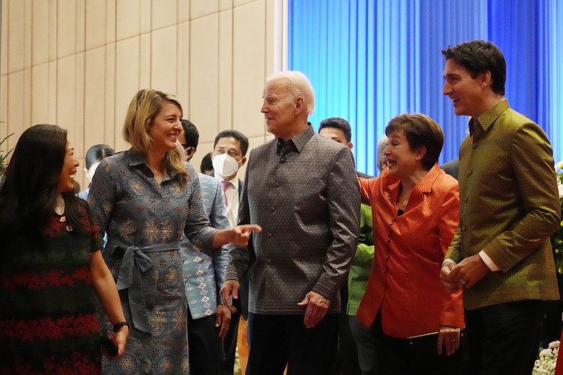 President Joe Biden speaks with Canadian Foreign Minister Melanie Holy (far left), International Monetary Fund President Kristalina Georgieva and Prime Minister Justin Trudeau of Canada, all wearing traditional Indonesian clothing, at the ASEAN gala dinner Saturday in Phnom Penh, Cambodia. More photos at arkansasonline.com/1113aseangala/.
(AP Photo/Alex Brandon)