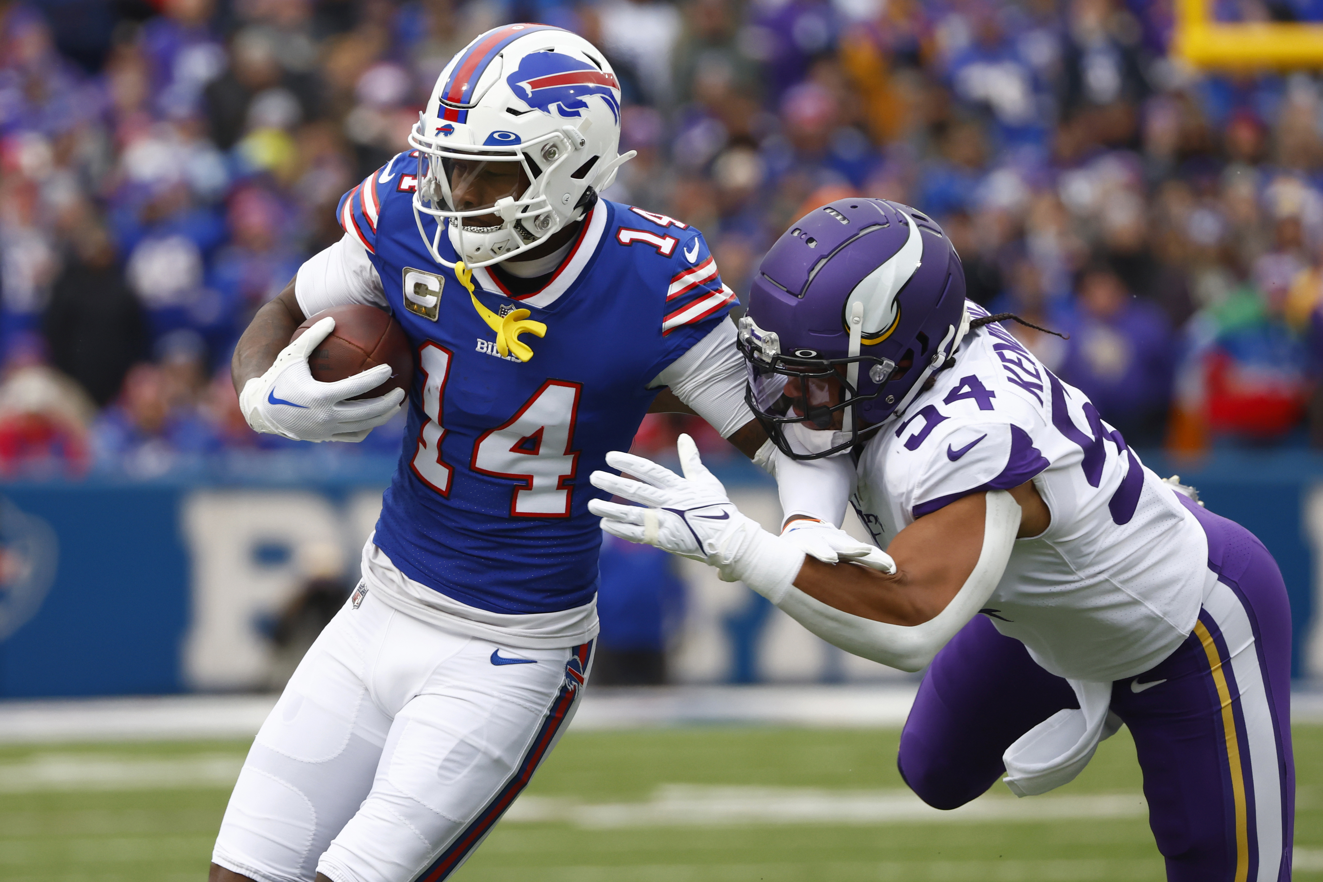 Buffalo Bills wide receiver Stefon Diggs (14) is brought down by Minnesota  Vikings linebacker Eric Kendricks (54) in the first half of an NFL football  game, Sunday, Nov. 13, 2022, in Orchard