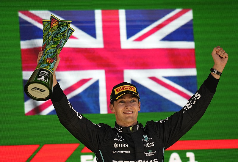 Mercedes driver George Russell, of Britain, celebrates his victory in the Brazilian Formula One Grand Prix at the Interlagos race track in Sao Paulo, Brazil, Sunday, Nov.13, 2022. (AP Photo/Andre Penner)