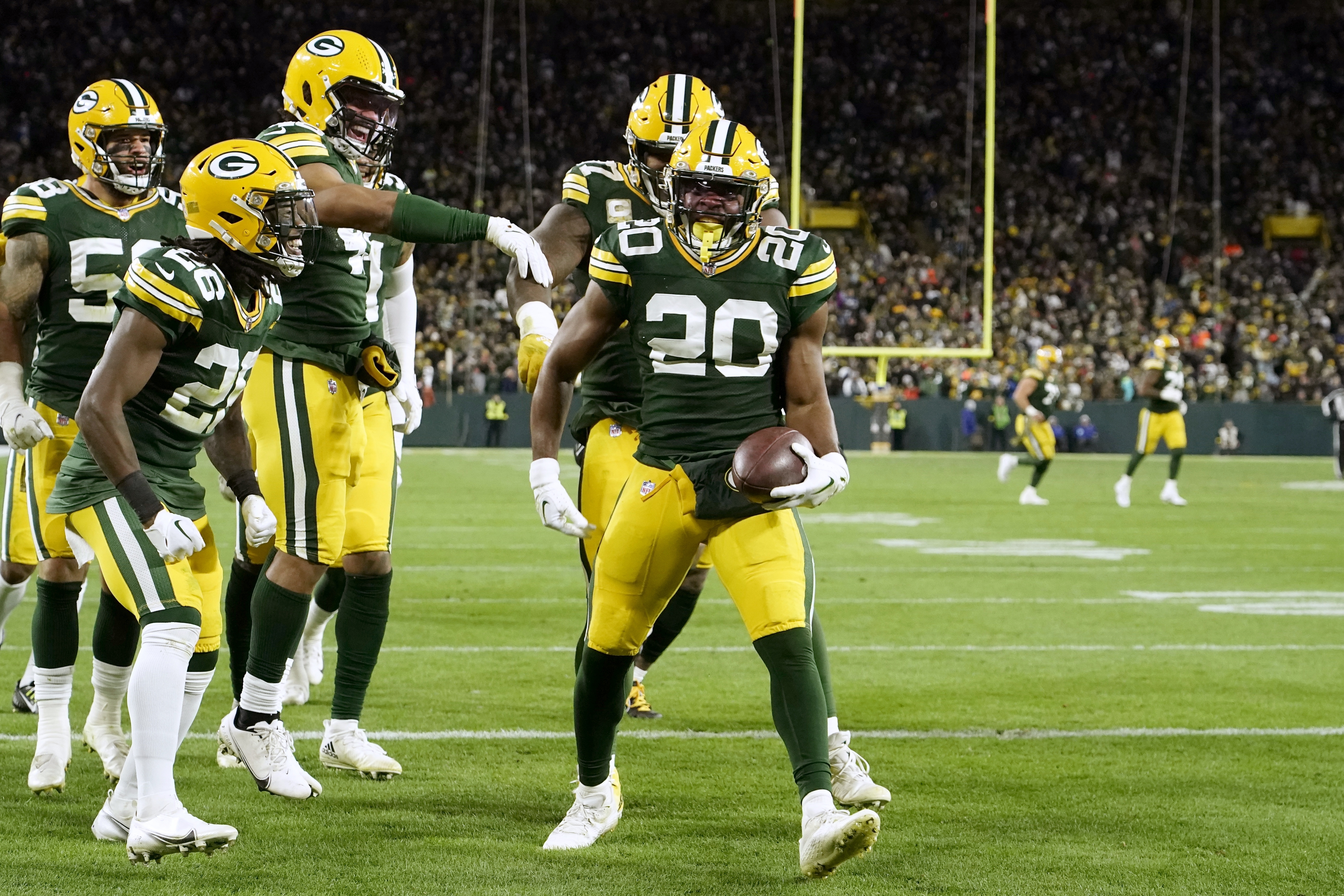 Green Bay Packers running back Aaron Jones (33) scores on a 56-yard  touchdown run during the se …