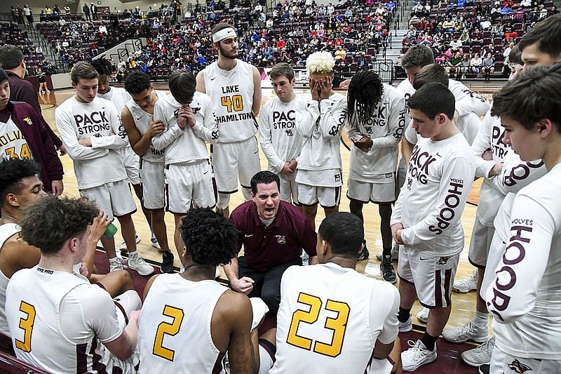 Lake Hamilton coach Scotty Pennington pumps up his team during a 4th quarter time-out during the first round game of the 5A state basketball tournament at Wolf Arena on Feb. 27, 2019. - File photo by The Sentinel-Record