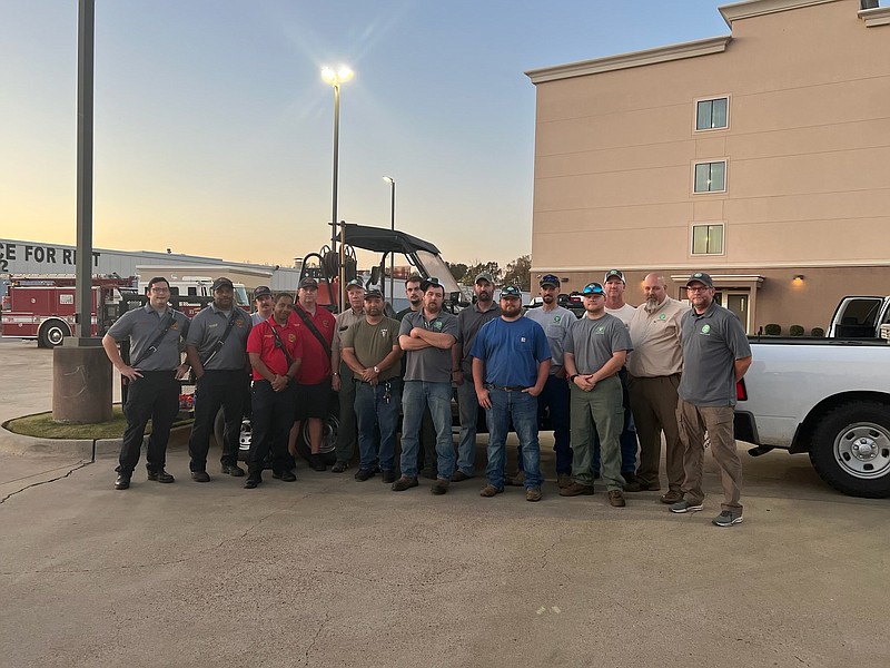 The eight Arkansas Forestry Division firefighters who traveled to Kentucky to help fight wildfires in the state are pictured with members of the Forest City Fire Department on Thursday, Nov. 10. (Courtesy of Katie West, Times Herald/Special to the News-Times)