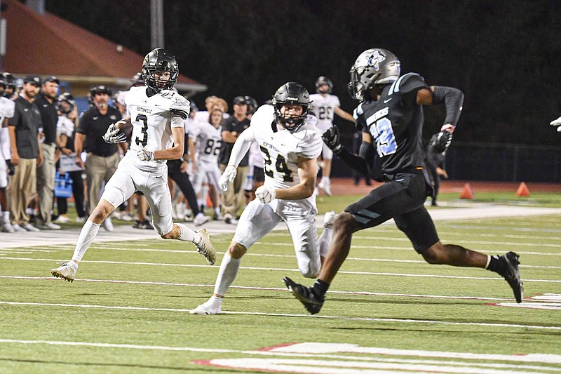 Bentonville defensive back JT Tomescko (3) returns an interception as teammate Johny Pike (24) blocks, Friday, Sept. 30, 2022, during the fourth quarter of the TigersÃ• 48-14 win over Fort Smith Southside at Jim Rowland Stadium in Fort Smith. 
(NWA Democrat-Gazette/Hank Layton)