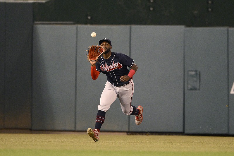 FILE - Atlanta Braves center fielder Michael Harris II makes a catch on a line drive by Washington Nationals' Joey Meneses for an out during the first inning of a baseball game, Monday, Sept. 26, 2022, in Washington. Seattle’s Julio Rodríguez and Harris, a pair of 21-year-old center fielders, are baseball's Rookies of the Year. (AP Photo/Nick Wass, File)