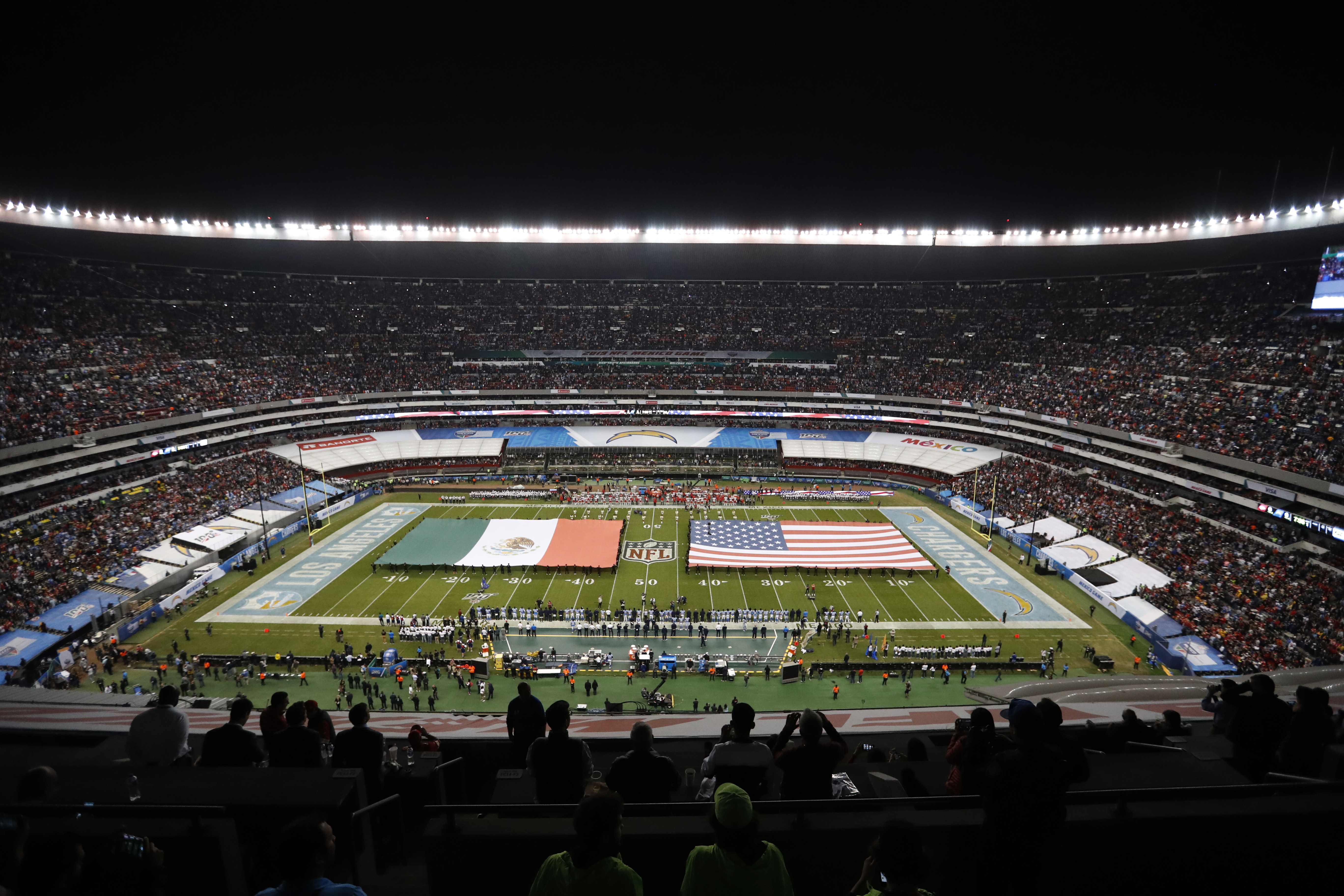 Arizona Cardinals guard Will Hernandez (76) wears a Mexico flag