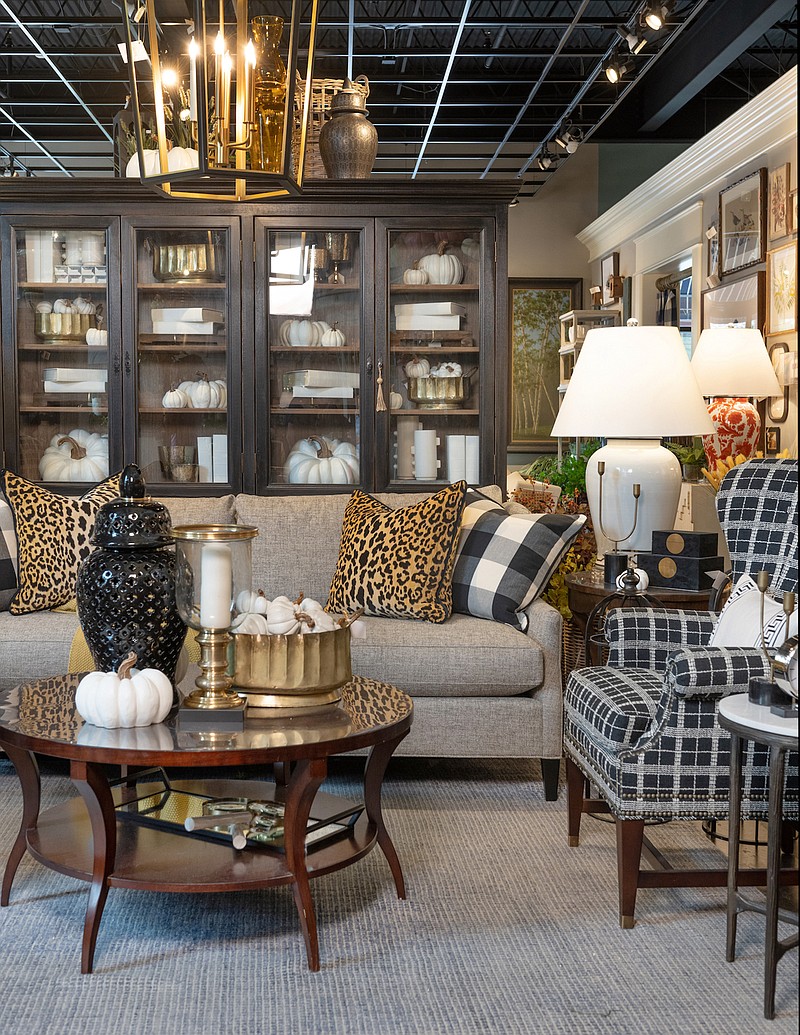 Buffalo plaid pillows and a black and white plaid chair mix and match beautifully in this stately room. (Provided photo/TNS)