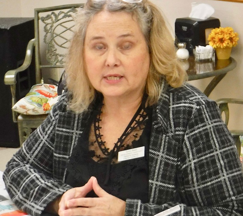 Westside Eagle Observer/SUSAN HOLLAND
Lynn Reed, community engagement manager for Habitat for Humanity of Benton County, speaks to members and guests of the Gravette Lions Club at their Nov. 15 meeting. Reed told about the procedure for building Habitat homes and outlined plans for future projects in the area. She encouraged all to donate money and materials to support the program.