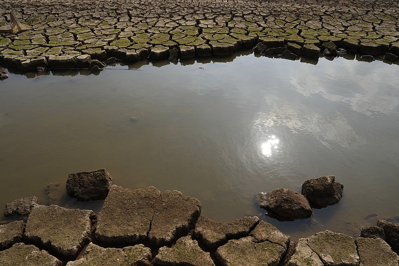 Parched earth frames the remainder of a tributary Oct. 31 on a dried arid stretch of the Poyang Lake in north-central China's Jiangxi province. (AP/Ng Han Guan)