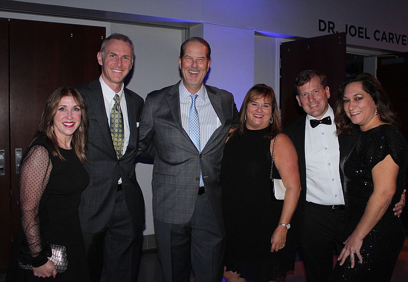 Kelly Kemp-McLintock and Ben McLintock (from left), Jim and Holly Breach and Tony and Emi Cardarelli gather at Big Night at The Jones Center. 
(NWA Democrat-Gazette/Carin Schoppmeyer)