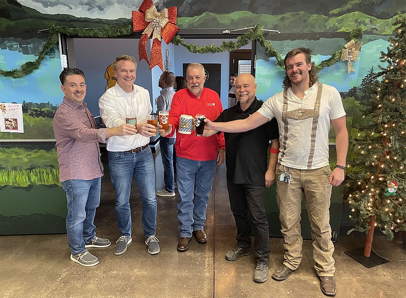 Members of the Ale-truism Board of Directors and Kent Eikenberry hoist a glass to celebrate Octoberfest, a third party fundraising event for the Northwest Arkansas Food Bank held at Goat Lab Brewery in Lowell on Oct. 8. Pictured from left are Tom Hauge, Dan Clous, Eikenberry, Bill Adams and Collen Adams.

(Courtesy Photo)