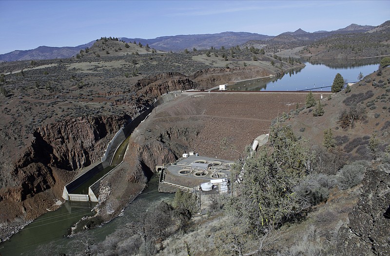 The Iron Gate Dam, powerhouse and spillway, is seen on the lower Klamath River on March 3, 2022, near Hornbrook, Calif. U.S. regulators approved a plan Thursday, Nov. 17, 2022 to demolish four dams on the California river and open up hundreds of miles of salmon habitat that would be the largest dam removal and river restoration project in the world when it goes forward. (AP Photo/Gillian Flaccus, File)