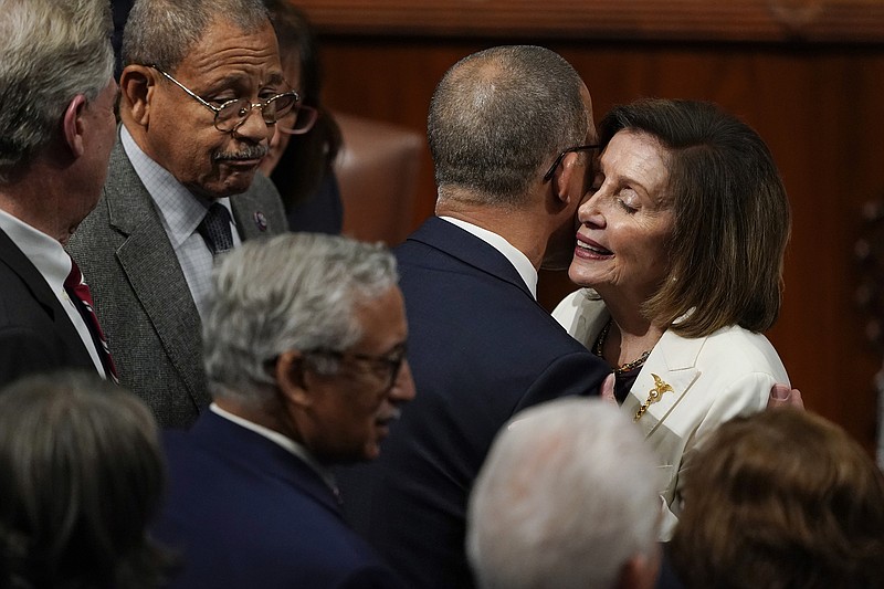 House Speaker Nancy Pelosi, D-Calif., is embraced after speaking on the House floor at the Capitol on Thursday, Nov. 17, 2022, in Washington. (AP Photo/Carolyn Kaster)