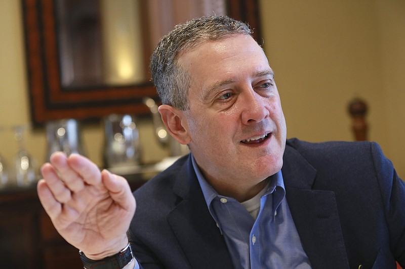 FILE - In this Nov. 19, 2019, photo James Bullard, president of the St. Louis Federal Reserve Bank, gestures during an interview in Richmond, Va. The Federal Reserve may have to raise its benchmark interest rate much higher than many people expect to get inflation under control, Bullard said Thursday, Nov. 17, 2022. (AP Photo/Steve Helber, File)