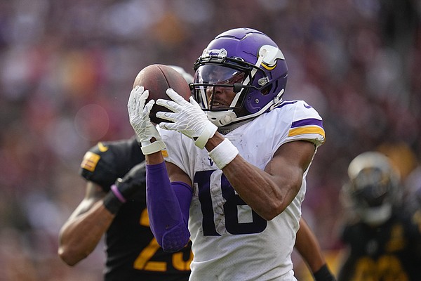 Minnesota Vikings wide receiver Justin Jefferson runs after the catch